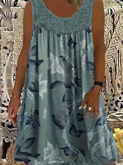 Elegantna maksi haljina za žene većih veličina s okruglim izrezom, bez rukava, čipkom, nabranim uzorkom i patchwork uzorkom.