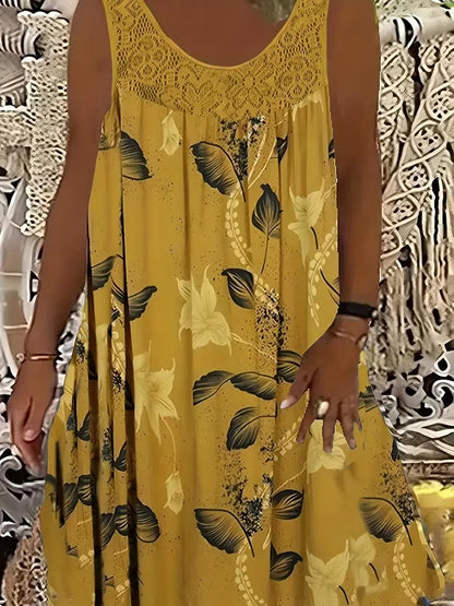 Elegantna maksi haljina za žene većih veličina s okruglim izrezom, bez rukava, čipkom, nabranim uzorkom i patchwork uzorkom.
